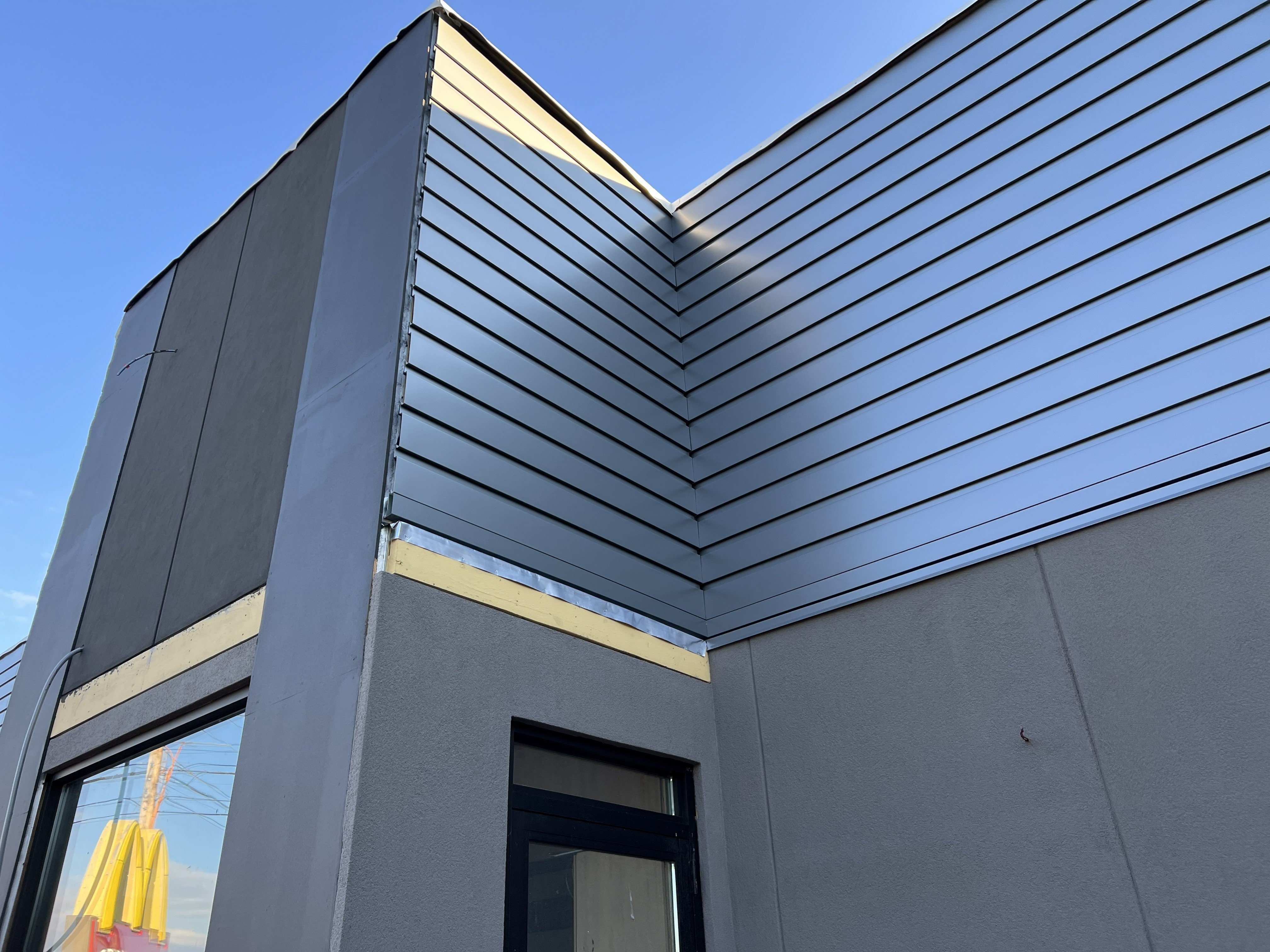 Completed building renovation with energy efficient metal roofing